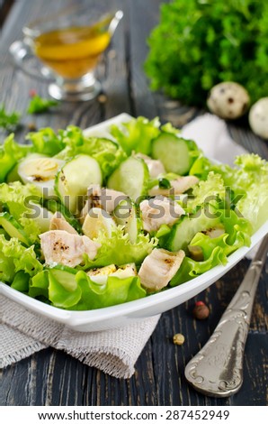 Vegetable salad with cod liver, seasoned with lemon sauce
