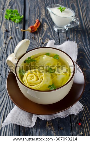 Lazy dumplings in broth - rolls with meat filling