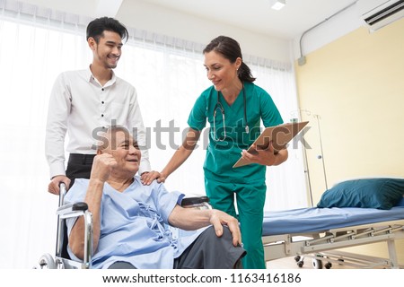 happy older patient on wheelchair with son and Caring doctor or male nurse smiling spending time together,about medic consultation on nursing home or hospital while spending morning,healthcare concept