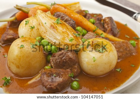 A French dish, navarin of lamb is a lamb stew with root vegetables, often served at Easter. It contains turnips, carrots, potatoes, onions and peas, in a thick glossy sauce.