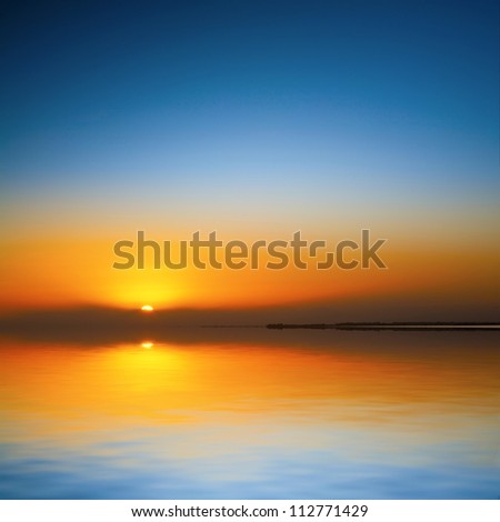 Sunset over Lake Ellesmere, Canterbury, New Zealand, on a clear evening. .