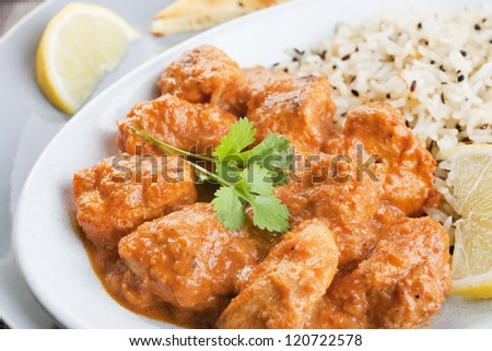 Chicken curry, or chicken tikka masala, a favourite Indian curry, with pilau rice.