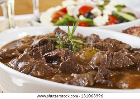 Greek Dish Stifado, Made With Lamb And Served With Greek Salad. Can Also Be Made With Beef Or Game.