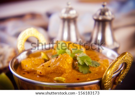 Favourite Indian meal, butter chicken with basmati rice, naan bread and lime. Holga lens, deliberately soft definition.