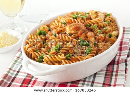 Pasta Bake with Chicken - fusili or spiral pasta, baked with chicken and marinara, topped with green chilli and parmesan.