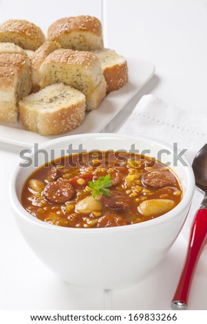 Spanish Chorizo Soup, with red lentils, tomatoes and butter beans, served with garlic bread.
