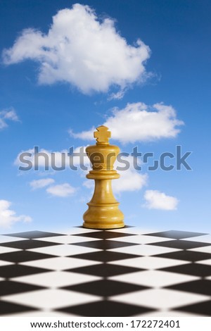 Chess - Fresh New Strategy - chess king on black and white board in front of blue sky. Concepts of fresh strategy, new decisions, breath of fresh air through your business.