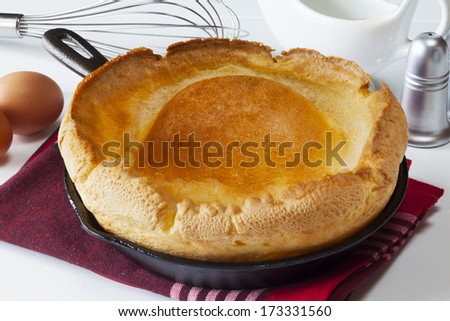Yorkshire Pudding - a large size Yorkshire Pudding, fresh from the oven and ready for eating in the traditional Yorkshire way - as a first course with gravy.