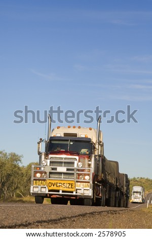 Two road trains on the Barkly Highway in Outback Queensland, Australia