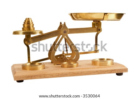 Old set of weighing scales with weights, isolated on white. This is an old chemical balance, and shows some wear and tear. Concepts of balance, choices,accuracy,comparison