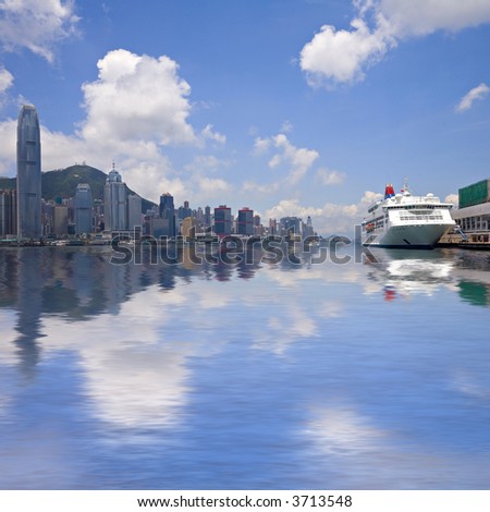 Victoria Harbour, Hong Kong, Kowloon. Cruise ship at Harbour City Ocean Terminal Victoria Peak in background behind the high rise buildings of Hong Kong Island. Photoshop reflection in harbour.