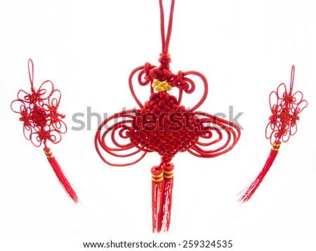 Three Chinese knots traditionally seen leading up to Chinese new year and other festivities taken with a fish eye lens