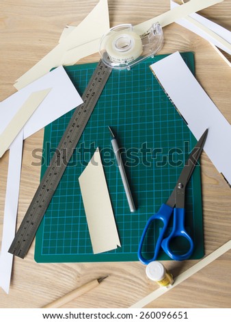 Paper craft/ scrap booking implements arranged on a table