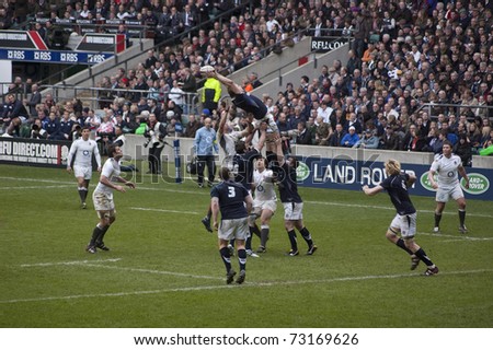 TWICKENHAM LONDON - MAR 13: Scottish lineout catch at England vs Scotland, England playing in white Win 22 -16, at RBS Six Nations Rugby Match on March 13, 2011 in Twickenham, England.