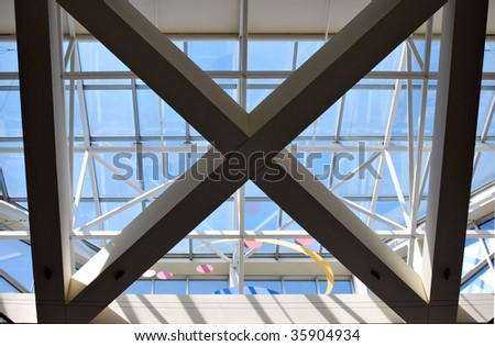 crossbeams on the interior of the building form an x