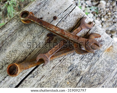 old rusted tools on wooden table