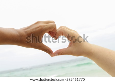 Two hands touching for heart love action for background.