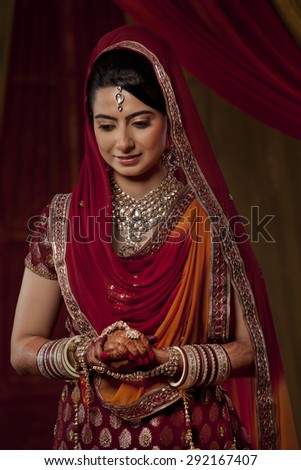 An Indian bride looking down