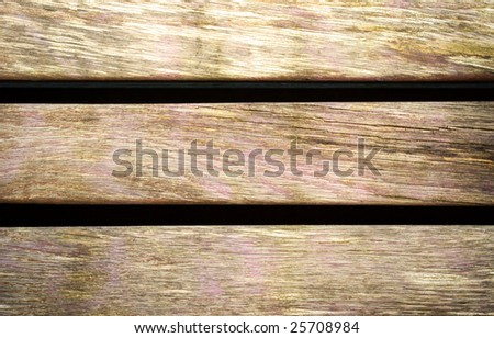 Weathered wooden texture on an old park bench