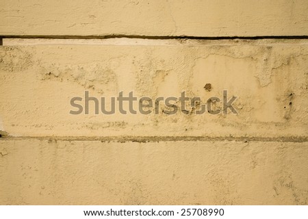 Weathered texture on cream paint on wall