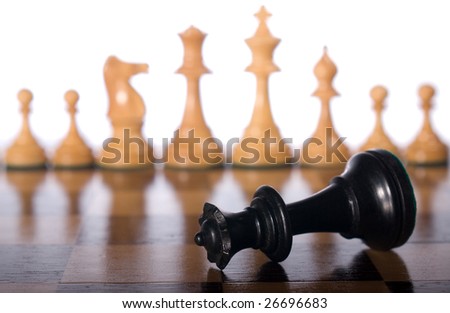 Chess queen on a chessboard as a business concept with out of focus chessmen