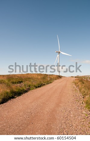 Path to a wind turbine on a wind farm in Scotland, Europe.