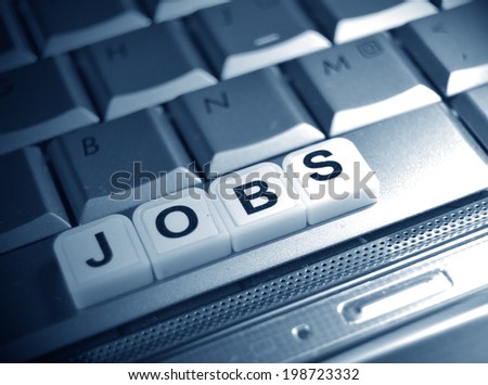 The word jobs on the keyboard under the spotlight