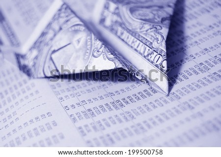One dollar banknote airplane on financial report background