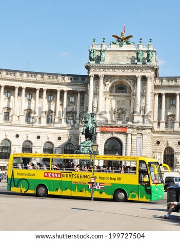 VIENNA, AUSTRIA - JULY 10, 2011: Touristic sightseeing bus in front of the National Library in Vienna, Austria