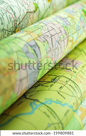 Various colorful road maps folded