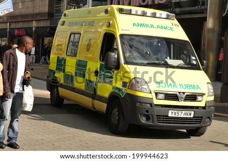 BIRMINGHAM, UK - SEPTEMBER 20, 2011: Ambulance responding to an emergency call in the city center of Birmingham