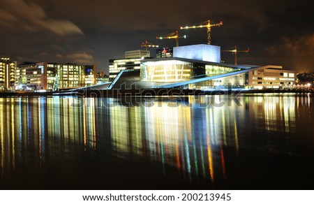 OSLO, NORWAY - DECEMBER 16, 2011: Night reflections of Opera House modern architecture in Oslo