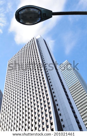 TOKYO, JAPAN - DECEMBER 28, 2011: Skyscraper in Shinjuku, Tokyo (Japan). In Tokyo, there are 42 buildings and structures that stand taller than 185 metres (607 ft).