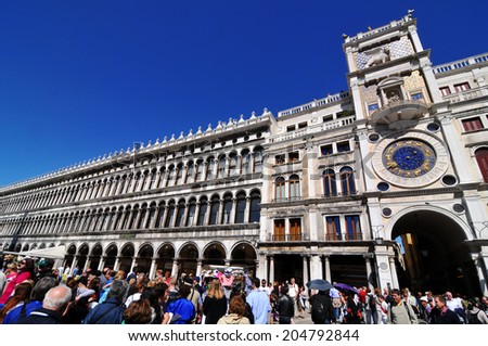 VENICE, ITALY - MAY 6, 2012: Tourists enjoy the sun in Piazza di San Marco (St. Mark\'s Square), Venice