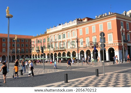 NICE, FRANCE - JULY 27, 2013: Tourists visit Place Massena, major commercial and cultural landmark in Nice.