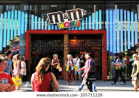 LONDON, UK - AUGUST 9, 2012: Tourists shop at the M&Ms World, a retail store specialized in M&Ms candy and merchandise.
