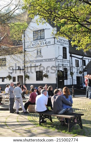 NOTTINGHAM, UK - APRIL 8, 2011: People enjoy a pint at Ye Olde Trip to Jerusalem, the oldest pub in England