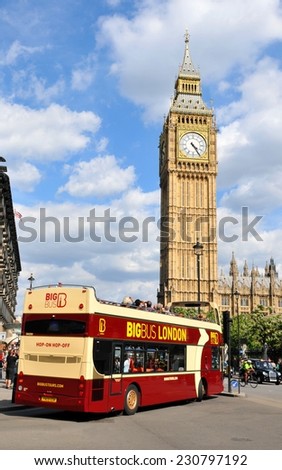 LONDON, UK. JULY 9, 2014: Tourists sightseeing Big Ben in central London from a tour bus.