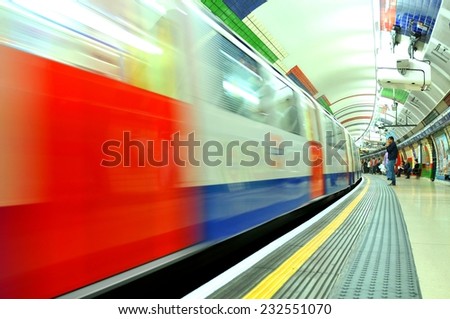 LONDON, UK - JULY 9, 2014: High speed train enters Piccadilly underground station in London.