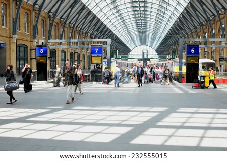 LONDON, UK - JULY 9, 2014: People transit the King\'s Cross train station in central London.