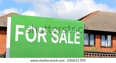 House for sale green sign