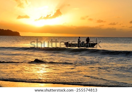 SAINT LUCIA, CARIBBEAN - DECEMBER 10, 2014: Tourists watch the sunset from cruise boat in Saint Lucia, Caribbean