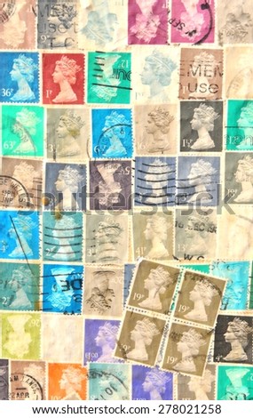 NOTTINGHAM, UK - APRIL 1, 2015: Old stamps depicting Queen Elizabeth decorate wall of vintage building in Nottingham, Nottinghamshire, East Midlands, England.