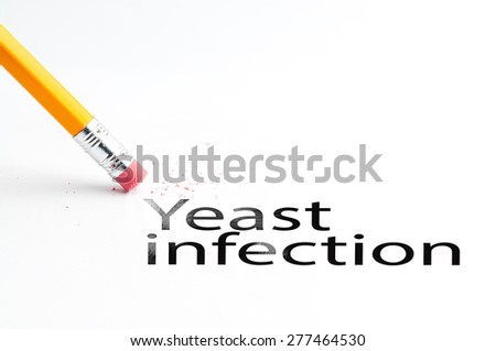 Closeup of pencil eraser and black yeast infection text. Yeast infection. Pencil with eraser.