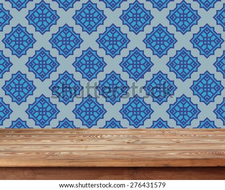 empty wooden table against vintage wall-paper