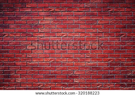 Wall from a red brick. Grunge texture. A background from red bricks.
