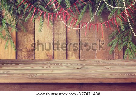 Background from boards with fir-tree branches from above, Empty wooden table, template, place for.