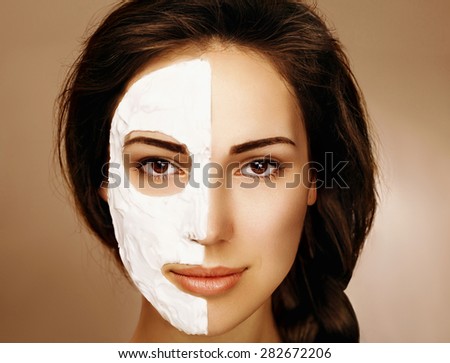 Beautiful woman with spa facial mask. In studio