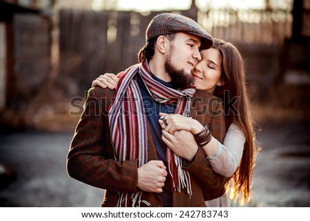 Lovely couple in a stylish brown clothes - backlit