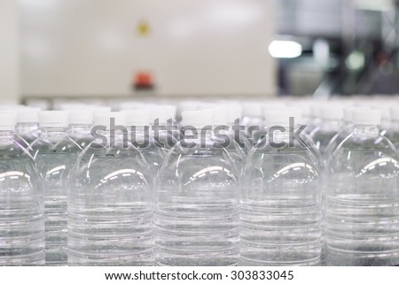 Water bottles on a filling line .Factory.